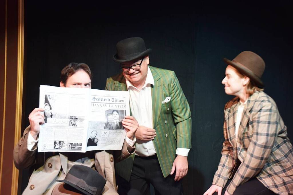Richard has a scare on the train when two passengers hand him the local news and he realizes he’s on the front page, wanted for murder (Barry Coulter/CranbrookTownsman)