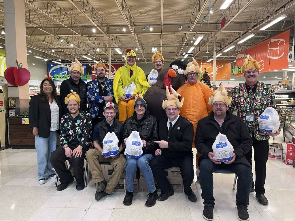 Save-On-Foods donated 100 turkeys to the Turkey Drive on Nov. 14. Standing (L-R) is Stacey Brensrud, Jon McWhirter, Jon Stammers, Julie Rose, Zak Hunt, Scott Dawson and Ted Murrell. Sitting (L-R), is Levi Moon, Ben Ankenbauer, Jason Caven, Rick Robins and Pete Davis (Gillian Francis/CranbrookTownsman)